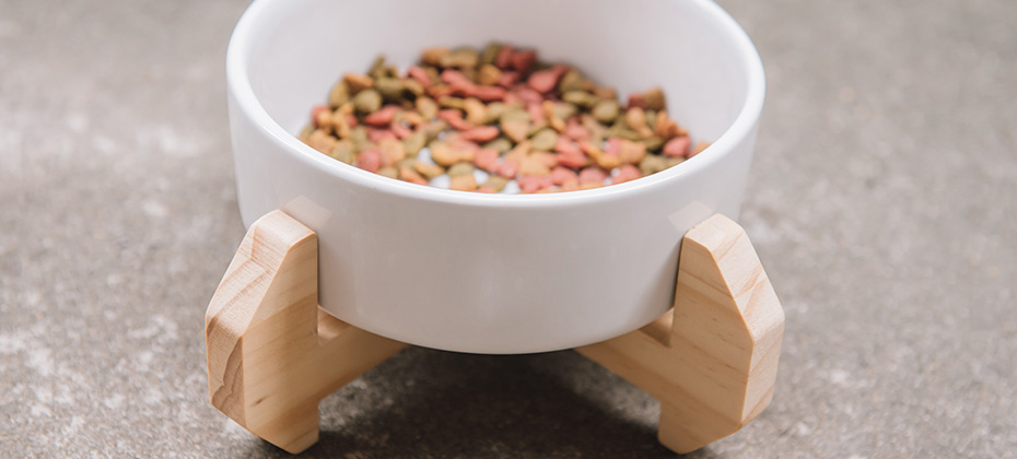 Wooden custom display for pet food bowl. Handmade cat dining table.